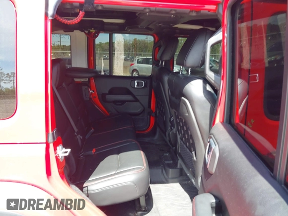 2020 Jeep Wrangler Unlimited Rubicon with VIN 1C4HJXFG9LW106607, listed as a IAAI auction lot 41908295 with 71,083 mi miles and . Bid and sale history available at DreamBid. Image 8.