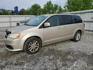2014 Dodge Grand Caravan SXT z VIN 2C4RDGCG1ER214411, wystawiony jako Copart lot #55497065 z przebiegiem 176 662 mil mil oraz Czysty tytuł • Clean title. Historia ofert i sprzedaży dostępna na DreamBid. Obrazek 1.