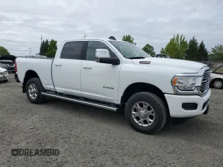 2023 Ram 2500 Laramie with VIN 3C6UR5FJ1PG634158, listed as a Copart auction lot 57164505 with 18,279 mi miles and Salvage title. Bid and sale history available at DreamBid. Image 4.