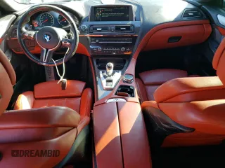 2015 BMW M6 z VIN WBS6C9C5XFD467854, wystawiony jako Copart lot #78871744 z przebiegiem 55 789 mil mil oraz Szkody całkowita. Historia ofert i sprzedaży dostępna na DreamBid. Obrazek 8.