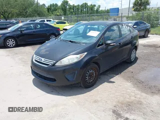 2013 Ford Fiesta SE z VIN 3FADP4BJ8DM218657, wystawiony jako IAAI lot #42361329 z przebiegiem 96 547 mil mil oraz . Historia ofert i sprzedaży dostępna na DreamBid. Obrazek 2.