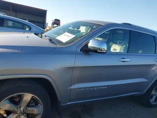 2014 Jeep Grand Cherokee Overland with VIN 1C4RJFCGXEC162238, listed as a IAAI auction lot 41291512 with 88,261 mi miles. Bid and sale history available at carsss.com. Image 14.