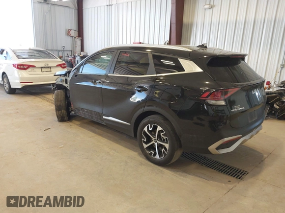 2023 Kia Sportage EX with VIN KNDPVCAG8P7095454, listed as a IAAI auction lot 42335661 with 96,718 mi miles and . Bid and sale history available at DreamBid. Image 3.