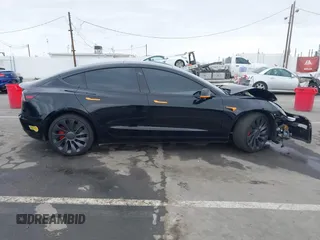 2022 Tesla Model 3 Performance with VIN 5YJ3E1EC3NF248534, listed as a IAAI auction lot 41882694 with 55,415 mi miles and . Bid and sale history available at carsss.com. Image 12.