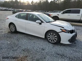 2020 Toyota Camry LE with VIN 4T1C11AK7LU977886, listed as a Copart auction lot 89102215 with 102,998 mi miles and Salvage Title. Bid and sale history available at carsss.com. Image 4.