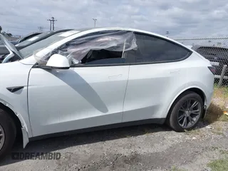 2024 Tesla Model Y with VIN 7SAYGDED2RF207783, listed as a IAAI auction lot 41758143 with Not Provided miles and . Bid and sale history available at DreamBid. Image 14.
