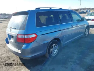 2005 Honda Odyssey EX-L with VIN 5FNRL38765B076591, listed as a IAAI auction lot 41624354 with 172,698 mi miles and . Bid and sale history available at DreamBid. Image 4.