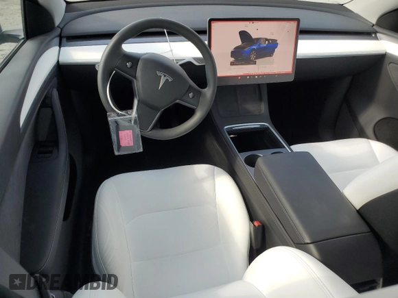 2023 Tesla Model Y Long Range z VIN 7SAYGDEE3PA178832, wystawiony jako Copart lot #57156005 z przebiegiem 12 920 mil mil oraz Szkoda całkowita • Salvage title. Historia ofert i sprzedaży dostępna na DreamBid. Obrazek 8.