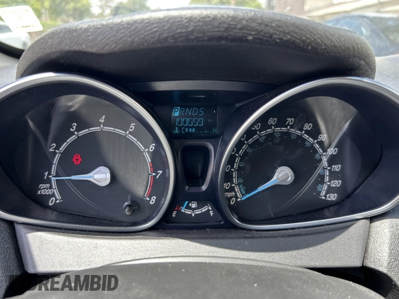 2015 Ford Fiesta SE z VIN 3FADP4EJ8FM167515, wystawiony jako IAAI lot #42153873 z przebiegiem 100 559 mil mil oraz . Historia ofert i sprzedaży dostępna na DreamBid. Obrazek 7.