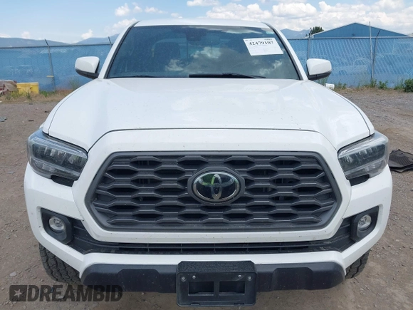 2022 Toyota Tacoma SR with VIN 3TMCZ5AN1NM478457, listed as a IAAI auction lot 42479107 with 59,547 mi miles and . Bid and sale history available at DreamBid. Image 13.