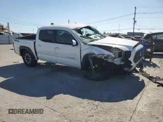 2020 Toyota Tacoma SR5 with VIN 3TMAZ5CN8LM115056, listed as a Copart auction lot 46948805 with 87,713 mi miles and Salvage title. Bid and sale history available at DreamBid. Image 4.