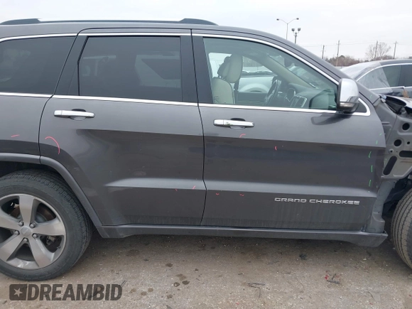 2014 Jeep Grand Cherokee Overland with VIN 1C4RJECG5EC207211, listed as a IAAI auction lot 41586309 with 115,293 mi miles. Bid and sale history available at carsss.com. Image 14.