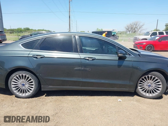 2016 Ford Fusion Titanium with VIN 3FA6P0K98GR158877, listed as a IAAI auction lot 41994013 with 57,027 mi miles and . Bid and sale history available at DreamBid. Image 14.