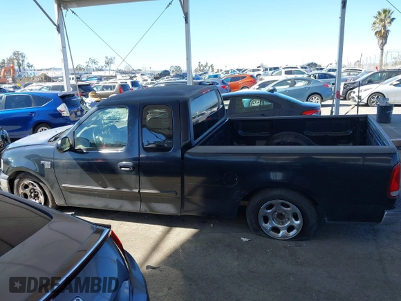 2002 Ford F-150 XL with VIN 1FTRX17WX2NB99454, listed as a IAAI auction lot 41643850 with 180,149 mi miles. Bid and sale history available at carsss.com. Image 14.