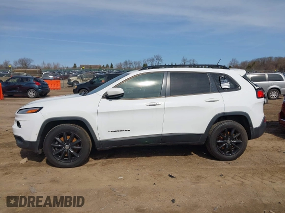2014 Jeep Cherokee Latitude with VIN 1C4PJMCB1EW301011, listed as a IAAI auction lot 41777745 with 133,643 mi miles and . Bid and sale history available at DreamBid. Image 14.