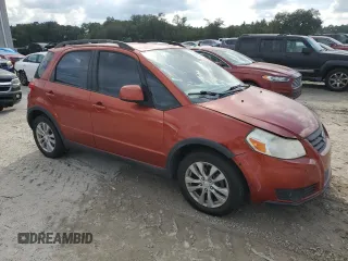 2013 Suzuki SX4 with VIN JS2YB5A42D6100038, listed as a Copart auction lot 73148344 with 141,675 mi miles and Salvage Title. Bid and sale history available at DreamBid. Image 4.