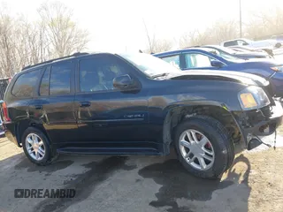2006 GMC Envoy Denali with VIN 1GKET63M962355586, listed as a IAAI auction lot 41881023 with 235,506 mi miles. Bid and sale history available at carsss.com. Image 13.
