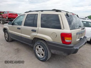 2001 Jeep Grand Cherokee Laredo with VIN 1J4GW48S51C566319, listed as a IAAI auction lot 42184875 with 148,471 mi miles and . Bid and sale history available at DreamBid. Image 3.
