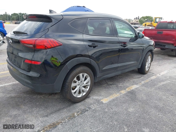 2019 Hyundai Tucson Value with VIN KM8J33A40KU068014, listed as a IAAI auction lot 40877057 with 34,966 mi miles. Bid and sale history available at carsss.com. Image 4.