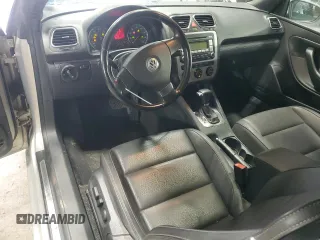 2009 Volkswagen Eos Komfort with VIN WVWBA71F69V019864, listed as a Copart auction lot 52378095 with 142,774 mi miles and Salvage Title. Bid and sale history available at DreamBid. Image 8.