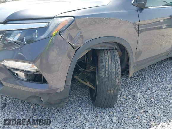 2018 Honda Pilot EX-L with VIN 5FNYF6H52JB066721, listed as a IAAI auction lot 42052842 with 134,393 mi miles and . Bid and sale history available at DreamBid. Image 6.