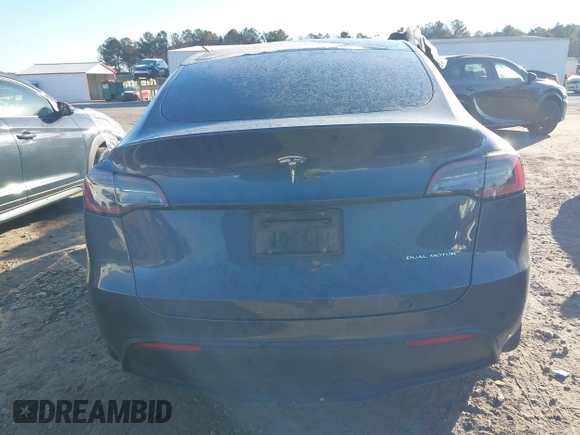 2023 Tesla Model Y Long Range with VIN 7SAYGDEE1PF647841, listed as a IAAI auction lot 41156390 with 33,473 mi miles. Bid and sale history available at carsss.com. Image 15.
