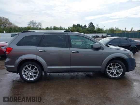 2012 Dodge Journey Crew z VIN 3C4PDCDG9CT146593, wystawiony jako IAAI lot #42127303 z przebiegiem 137 861 mil mil oraz . Historia ofert i sprzedaży dostępna na DreamBid. Obrazek 14.