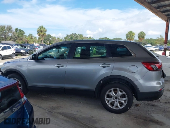 2015 Mazda CX-9 Sport with VIN JM3TB2BA0F0447436, listed as a IAAI auction lot 42480482 with 127,557 mi miles and . Bid and sale history available at DreamBid. Image 14.