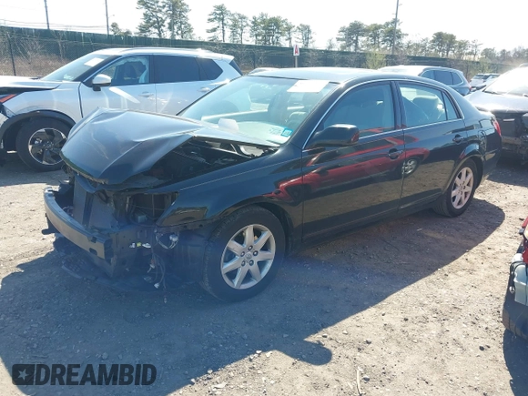 2005 Toyota Avalon XL with VIN 4T1BK36B95U048332, listed as a IAAI auction lot 41977547 with 61,293 mi miles and . Bid and sale history available at carsss.com. Image 2.
