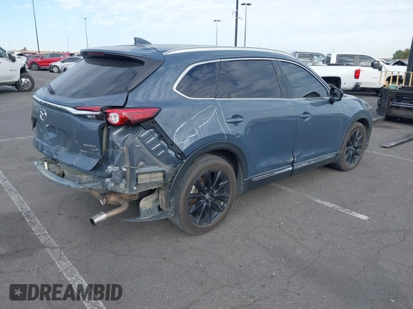 2021 Mazda CX-9 Grand Touring with VIN JM3TCADY1M0519288, listed as a IAAI auction lot 41186094 with 50,701 mi miles and . Bid and sale history available at DreamBid. Image 4.