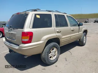 1999 Jeep Grand Cherokee Limited with VIN 1J4GW68N2XC654713, listed as a IAAI auction lot 42115829 with 195,988 mi miles. Bid and sale history available at carsss.com. Image 4.
