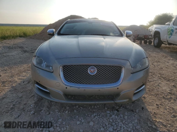 2014 Jaguar XJ Portfolio with VIN SAJWJ2GD7E8V61558, listed as a Copart auction lot 66850034 with 130,984 mi miles and Salvage title. Bid and sale history available at DreamBid. Image 5.