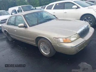 1999 Mercury Grand Marquis GS z VIN 2MEFM74W4XX645430, wystawiony jako IAAI lot #42154522 z przebiegiem 152 306 mil mil oraz . Historia ofert i sprzedaży dostępna na DreamBid. Obrazek 1.
