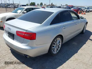 2013 Audi A6 Premium Plus with VIN WAUDFAFCXDN051423, listed as a IAAI auction lot 42249789 with 124,372 mi miles and . Bid and sale history available at DreamBid. Image 4.