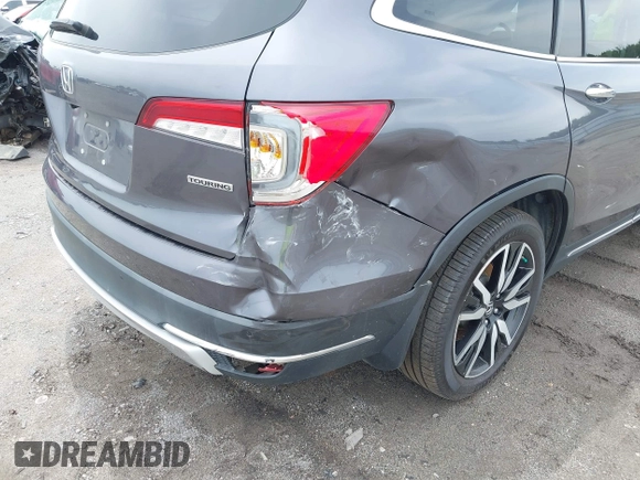 2019 Honda Pilot Touring 8-Passenger with VIN 5FNYF5H93KB028641, listed as a IAAI auction lot 42524078 with 56,744 mi miles and . Bid and sale history available at DreamBid. Image 19.