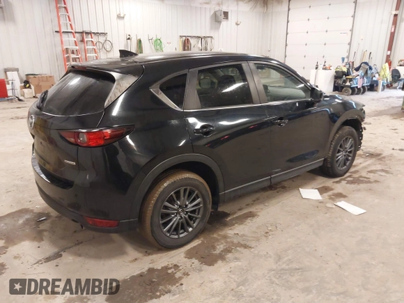 2021 Mazda CX-5 Touring with VIN JM3KFBCM1M1380409, listed as a IAAI auction lot 41677537 with 55,319 mi miles. Bid and sale history available at carsss.com. Image 4.