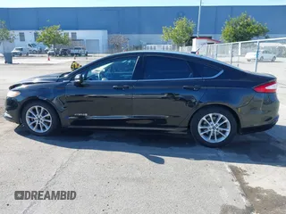 2015 Ford Fusion SE Hybrid with VIN 3FA6P0LU9FR294551, listed as a IAAI auction lot 41545007 with 179,906 mi miles. Bid and sale history available at carsss.com. Image 15.