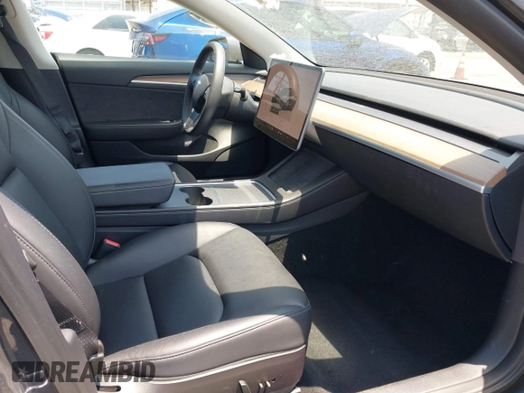2023 Tesla Model 3 with VIN 5YJ3E1EA4PF400306, listed as a IAAI auction lot 42398603 with 18,551 mi miles and . Bid and sale history available at DreamBid. Image 5.