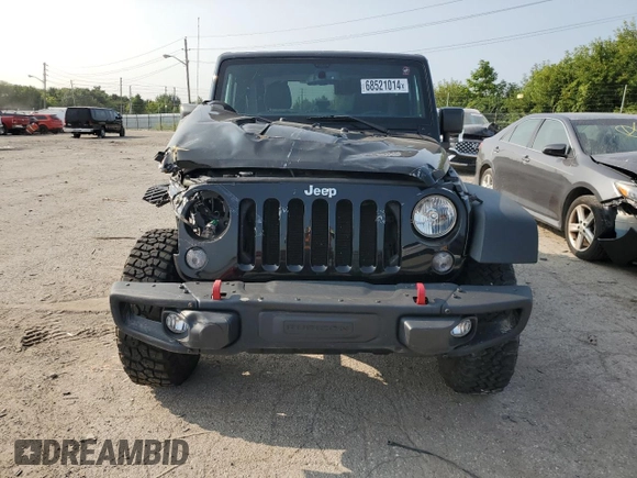 2015 Jeep Wrangler Rubicon Hard Rock z VIN 1C4BJWCG9FL714606, wystawiony jako Copart lot #68521014 z przebiegiem 35 187 mil mil oraz Szkoda całkowita • Salvage title. Historia ofert i sprzedaży dostępna na DreamBid. Obrazek 5.