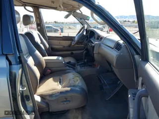 1997 Toyota Land Cruiser with VIN JT3HJ85JXV0174430, listed as a IAAI auction lot 41502690 with 300,632 mi miles. Bid and sale history available at carsss.com. Image 5.