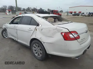 2011 Ford Taurus SE with VIN 1FAHP2DW3BG113398, listed as a IAAI auction lot 41617959 with 123,706 mi miles. Bid and sale history available at carsss.com. Image 3.