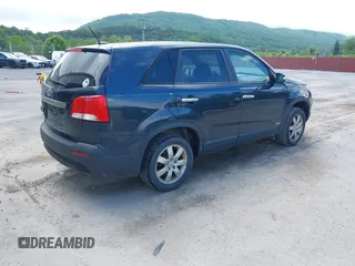 2013 Kia Sorento LX with VIN 5XYKTCA60DG403769, listed as a IAAI auction lot 42265980 with 215,013 mi miles and . Bid and sale history available at DreamBid. Image 4.