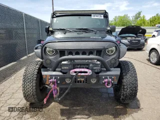 2012 Jeep Wrangler Unlimited Sahara with VIN 1C4BJWEG4CL120370, listed as a Copart auction lot 58744135 with 166,455 mi miles and Clean title. Bid and sale history available at DreamBid. Image 5.