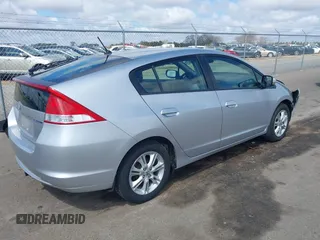 2010 Honda Insight EX with VIN JHMZE2H71AS017996, listed as a IAAI auction lot 42091356 with 142,474 mi miles and . Bid and sale history available at DreamBid. Image 4.