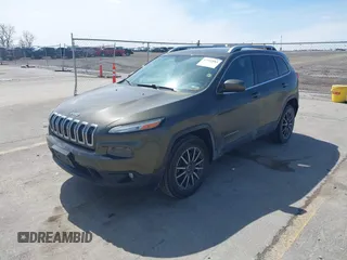 2015 Jeep Cherokee North with VIN 1C4PJMCS9FW588826, listed as a IAAI auction lot 41952883 with 145,586 mi miles. Bid and sale history available at carsss.com. Image 2.