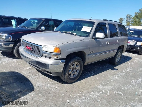 2005 GMC Yukon SLT with VIN 1GKEC13TX5J104235, listed as a IAAI auction lot 41574343 with 291,358 mi miles. Bid and sale history available at carsss.com. Image 2.