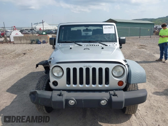 2011 Jeep Wrangler Sport with VIN 1J4AA2D18BL546069, listed as a IAAI auction lot 42139693 with 56,395 mi miles and . Bid and sale history available at carsss.com. Image 13.