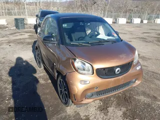 2016 Smart fortwo Passion z VIN WMEFJ5DA6GK079651, wystawiony jako IAAI lot #41607293 z przebiegiem 146 753 mil mil oraz . Historia ofert i sprzedaży dostępna na DreamBid. Obrazek 1.