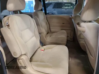 2009 Honda Odyssey LX with VIN 5FNRL38259B018546, listed as a Copart auction lot 62142015 with 162,459 mi miles and Salvage title. Bid and sale history available at DreamBid. Image 11.
