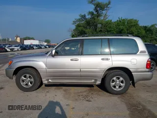 2001 Toyota Land Cruiser z VIN JTEHT05J912007249, wystawiony jako IAAI lot #42409963 z przebiegiem 303 292 mil mil oraz . Historia ofert i sprzedaży dostępna na DreamBid. Obrazek 14.